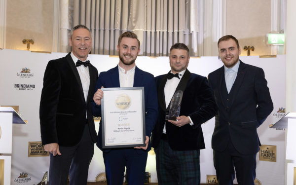 Centre left to right Kevin Pigott Global Winner Brand Ambassador Irish Whiskey of the Year and James Hutchinson Account Manager Mc Laren Packaging